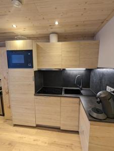 Kuchyň nebo kuchyňský kout v ubytování Superbe appartement sur le front de neige