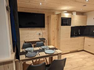 Kuchyň nebo kuchyňský kout v ubytování Superbe appartement sur le front de neige