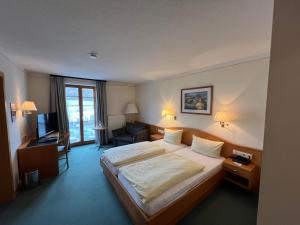 Postel nebo postele na pokoji v ubytování Gasthof Hummel Hotel