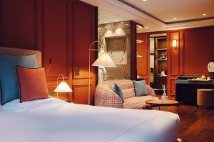 a hotel room with a bed and a chair at Eight Hotel Portofino in Portofino