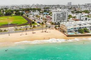 an aerial view of a beach and buildings at Portocafe Ocean Park Home 5Bd 4b Pool WalkToBeach in San Juan