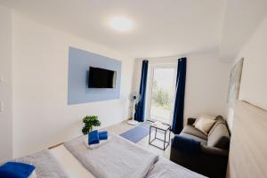 Postel nebo postele na pokoji v ubytování Ferienhaus Schöne Aussicht Ferienwohnung Blau