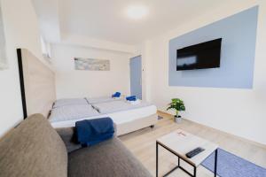 Postel nebo postele na pokoji v ubytování Ferienhaus Schöne Aussicht Ferienwohnung Blau