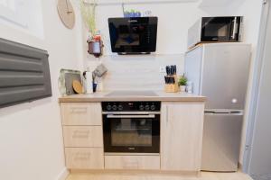 Kuchyň nebo kuchyňský kout v ubytování Ferienhaus Schöne Aussicht Ferienwohnung Blau + 10 fotografií
