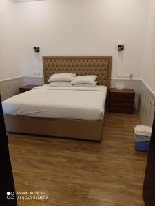 Postel nebo postele na pokoji v ubytování Royal Residence Hotel Apartments