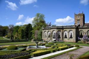 an old building with a fountain in a garden at Temple of Diana in Shifnal