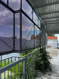 a view from the inside of a building with a balcony at HP home & coffee in Buon Ma Thuot