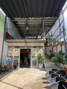 a building with a balcony on the side of it at HP home & coffee in Buon Ma Thuot