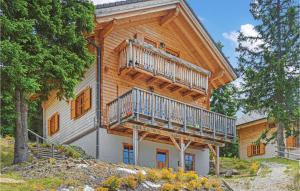 a large wooden house with a balcony on it at Stunning Home In St, Stefan With 3 Bedrooms And Sauna in Elsenbrunn
