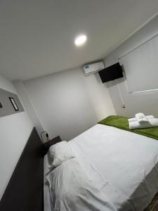 Apartamentos El Fortín客房内的一张或多张床位