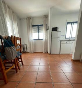 A kitchen or kitchenette at La Rosada 9