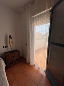 A bed or beds in a room at La Rosada 9