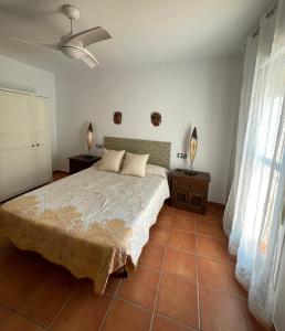 A bed or beds in a room at La Rosada 9