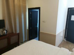 Postel nebo postele na pokoji v ubytování Royal Residence Hotel Apartments
