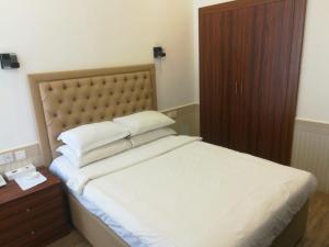 Postel nebo postele na pokoji v ubytování Royal Residence Hotel Apartments