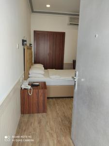 Postel nebo postele na pokoji v ubytování Royal Residence Hotel Apartments