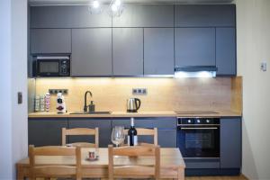 Kuchyň nebo kuchyňský kout v ubytování Apartmán na Hůrce