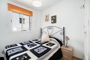 Ένα ή περισσότερα κρεβάτια σε δωμάτιο στο Apartamento Merce