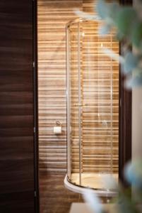 a bathroom with a shower with wooden blinds at Lovely holiday home next to Bus terminus in St Paul's Bay