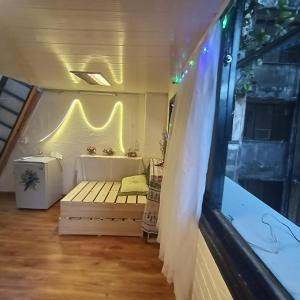 a room with a bed and a tub in a house at Private Homestay 402 Lily's house 2 beds in city center in Ho Chi Minh City