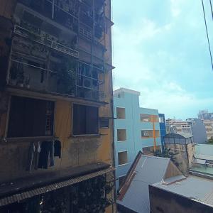 a building with windows on the side of it at Private Homestay 402 Lily's house 2 beds in city center in Ho Chi Minh City