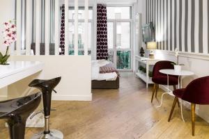 A seating area at Romana Flexyrent Apartment