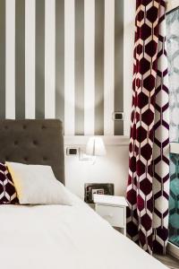 A bed or beds in a room at Romana Flexyrent Apartment
