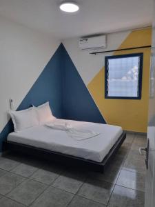 Postel nebo postele na pokoji v ubytování Zebra House - Bonamoussadi