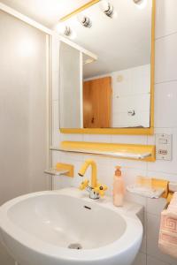a bathroom with a sink and a mirror at SE034 - Senigallia, graziosa mansarda con vista mare in Senigallia