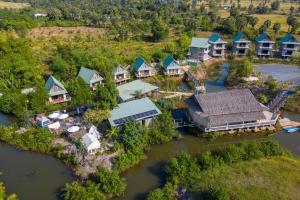 an aerial view of a resort on a river at Kampot Eco Village in Kampot