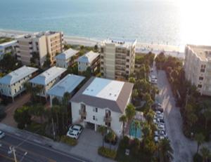 an aerial view of a city with the beach and buildings at Casa Mar Y Palmera 202a in Clearwater Beach