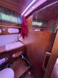 a small bathroom with a sink and a mirror at El Velero in Puerto Calero