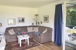 a living room with a couch and a table at Möwe in Kappeln