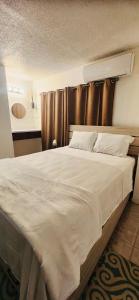 Llit o llits en una habitació de Studio21-B Centric Comfort House