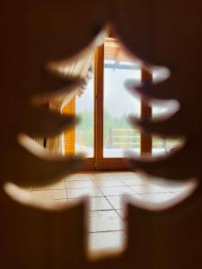 a view of a door through a window at Fifth Element Retreat in Borzont