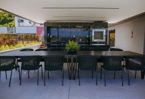 a dining area with a table and chairs at Unity by Hosppedar in Penha +77 photos