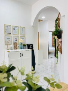 a room with a white cabinet and a mirror at 6-10Pax 大山脚 SingleStoreySemi-D BM-Alma NearAEON Wifi Netflix in Bukit Mertajam