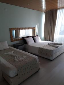 Postel nebo postele na pokoji v ubytování Gvar Apart Hotel