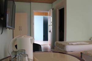 Postel nebo postele na pokoji v ubytování Gvar Apart Hotel