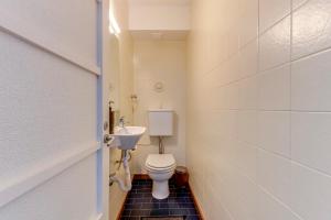 a small bathroom with a toilet and a sink at Quiet Point in Porto +46 photos