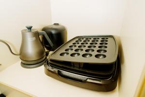 Kohvi ja tee valmistamise võimalus majutusasutuses LARGE HOUSE Lodging Hidamari