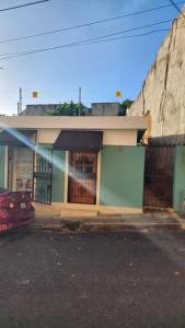 a building with a car parked in front of it at Casa de Nini in Santo Domingo