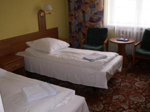 Un pat sau paturi într-o cameră la AGRO obiekt hotelowy