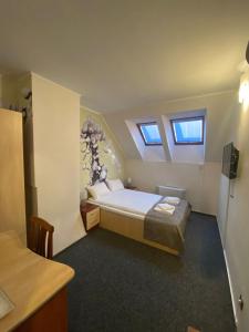 Postel nebo postele na pokoji v ubytování Hotel Stadion