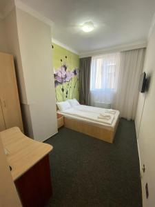 Postel nebo postele na pokoji v ubytování Hotel Stadion