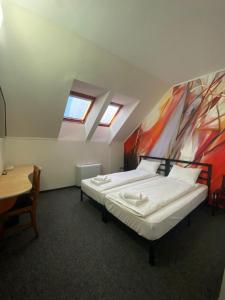 Postel nebo postele na pokoji v ubytování Hotel Stadion