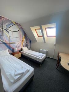 Postel nebo postele na pokoji v ubytování Hotel Stadion