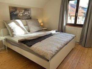 Postel nebo postele na pokoji v ubytování Beim Patzelt - Ferienhaus in Nesselwang