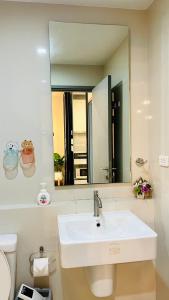 a bathroom with a sink and a mirror at The base Central Pattaya 271 by Numam in Pattaya Central