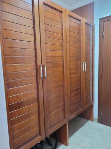 a pair of wooden cabinets in a room at Anastasija 109 in Kopaonik